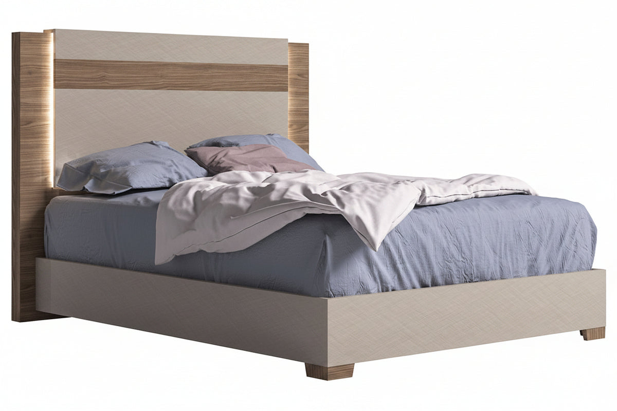 Bed with wooden headboard and gray bedding on a white background