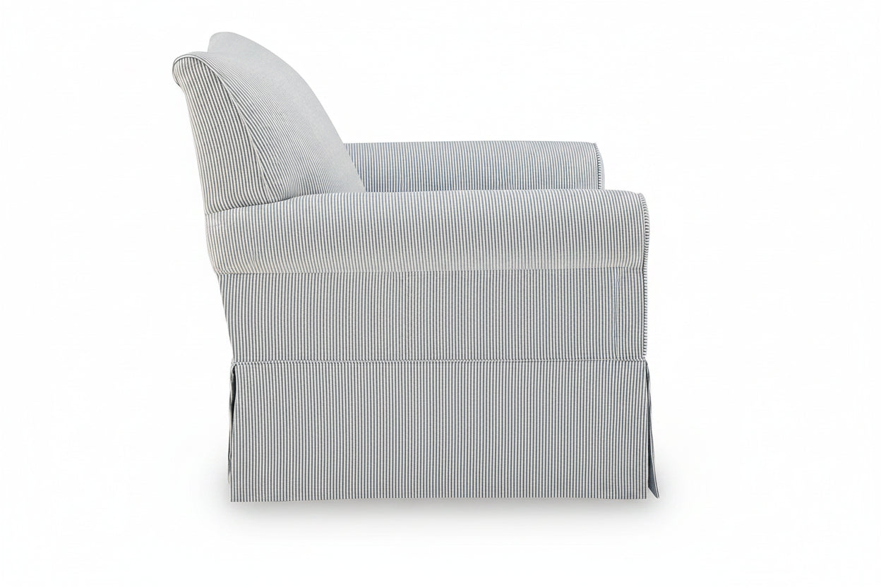 A light gray upholstered armchair with a subtle vertical stripe pattern, shown from a three-quarter angle against a plain white background.