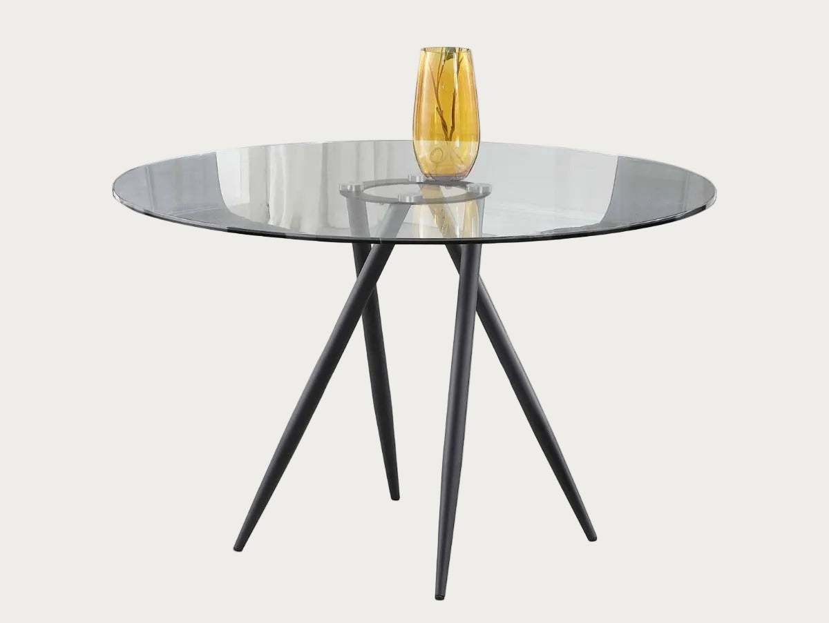 Beatriz round glass table with black metal legs on a white background