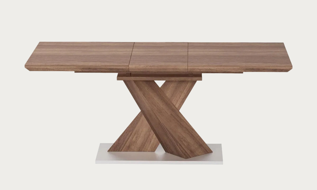 Bethany wooden dining table with a unique X-shaped base on a white background