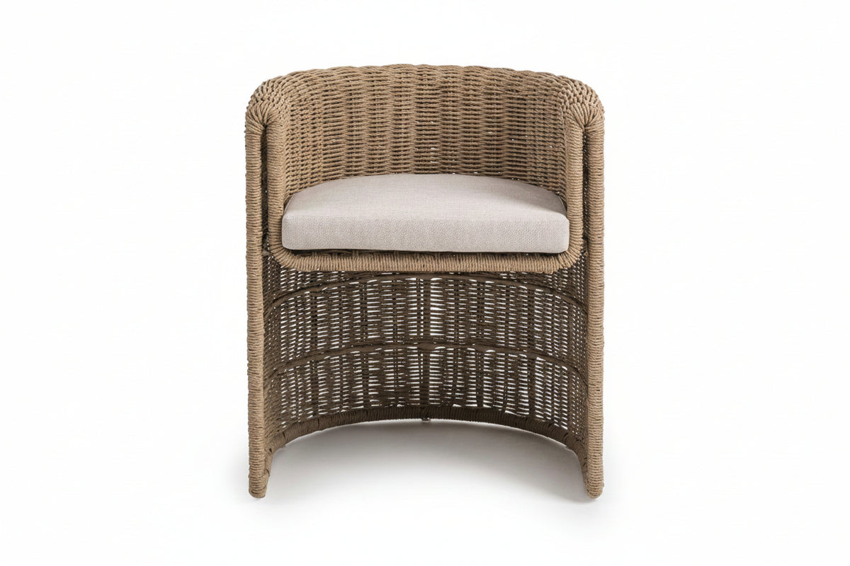 Wicker chair with a cushion on a white background