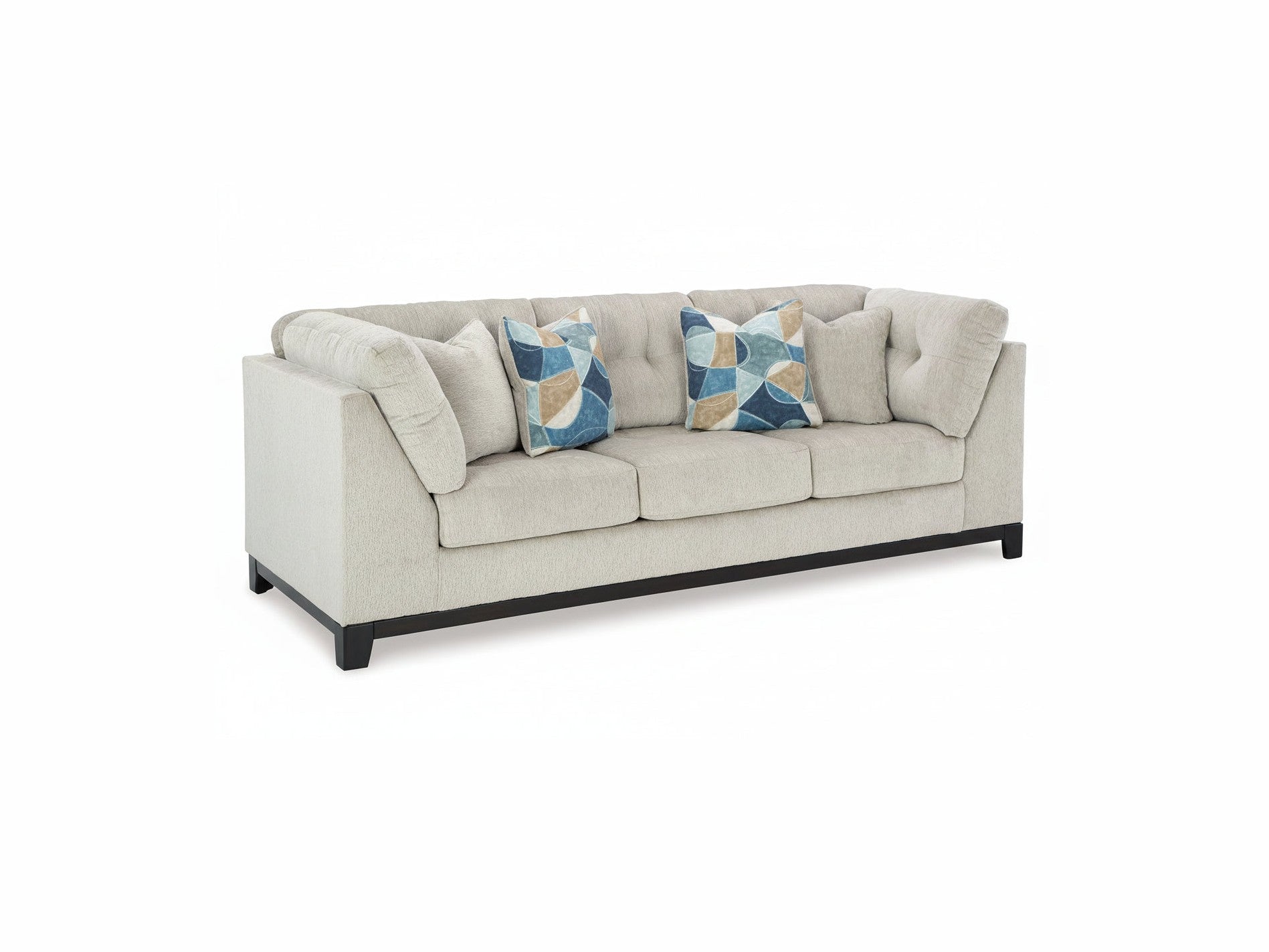 Beige sofa with decorative pillows on a white background