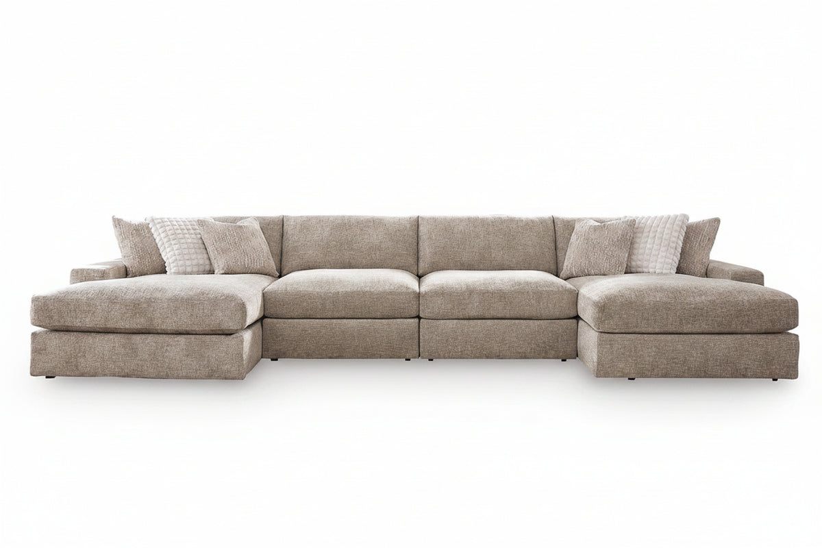 A light beige textured fabric sectional sofa with a left-facing chaise lounge and matching accent pillows, shown against a plain white background.