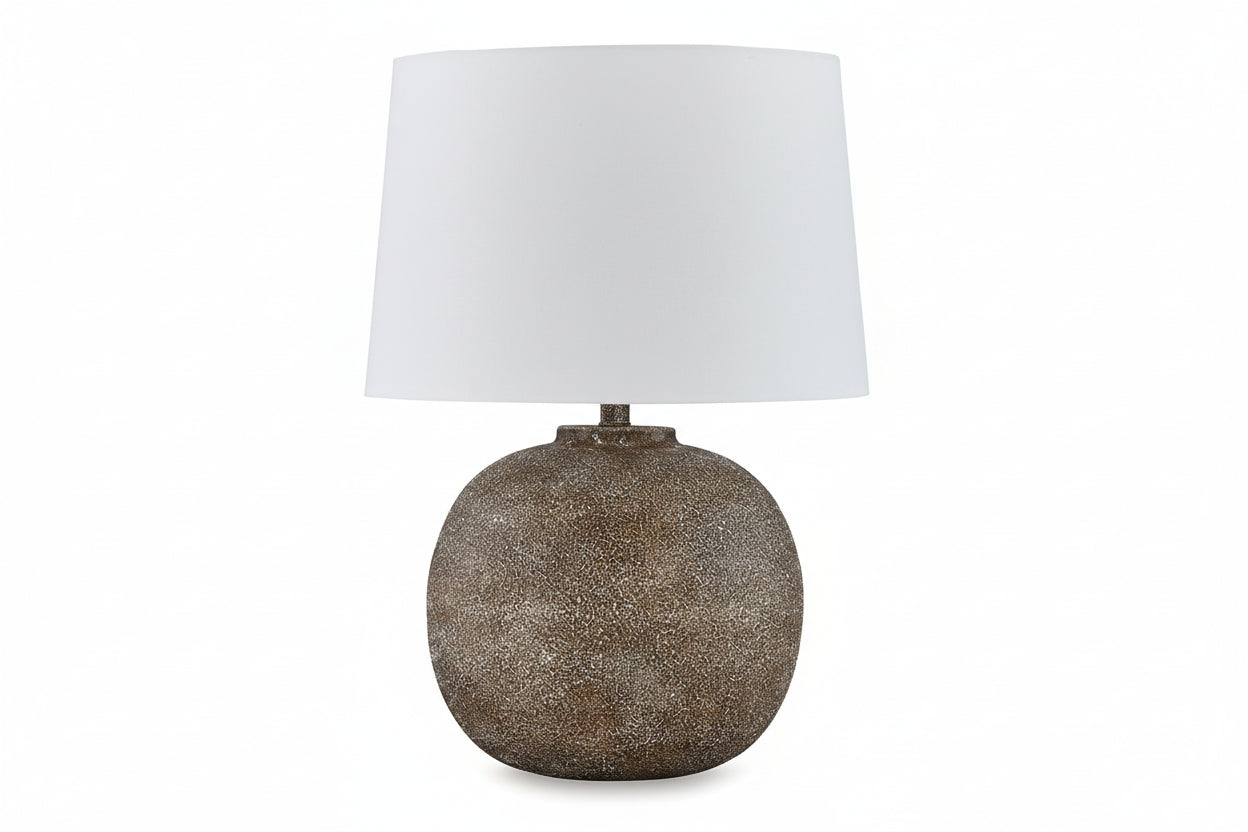 Neavesboro table lamp with textured base and white shade on a white background.