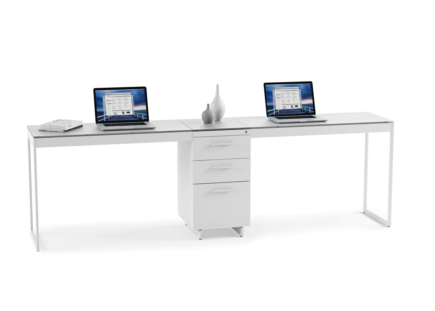 White office desk with two laptops on a white background