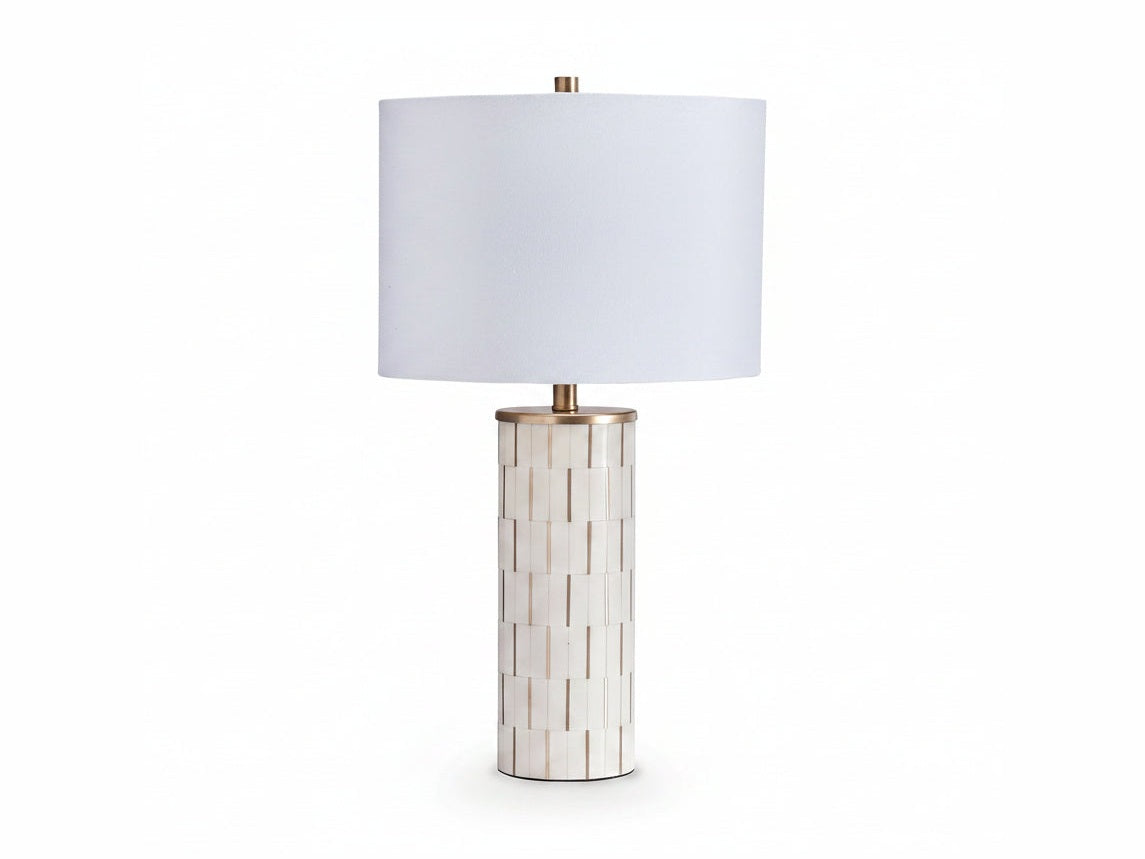 Faridworth table lamp with white shade and decorative cylindrical base on a white background.