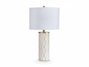 Faridworth table lamp with white shade and decorative cylindrical base on a white background.