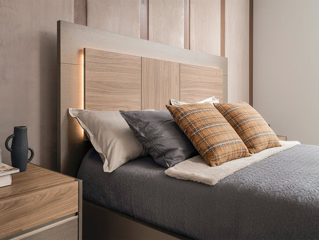 Modern bedroom setup with wooden headboard, pillows, and nightstand.