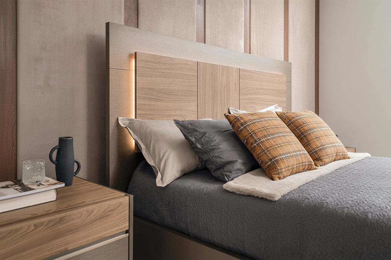 Modern bedroom setup with wooden headboard, pillows, and nightstand.