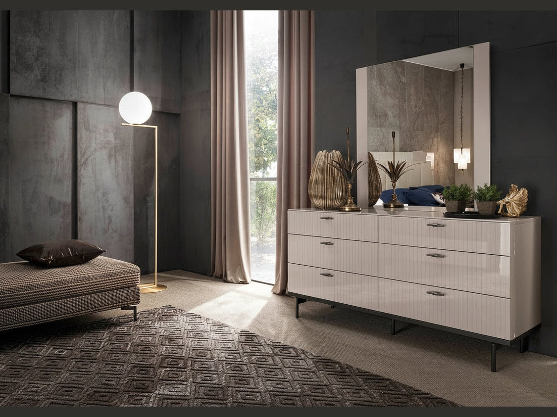 Claire modern dresser, mirror, and decorative items.