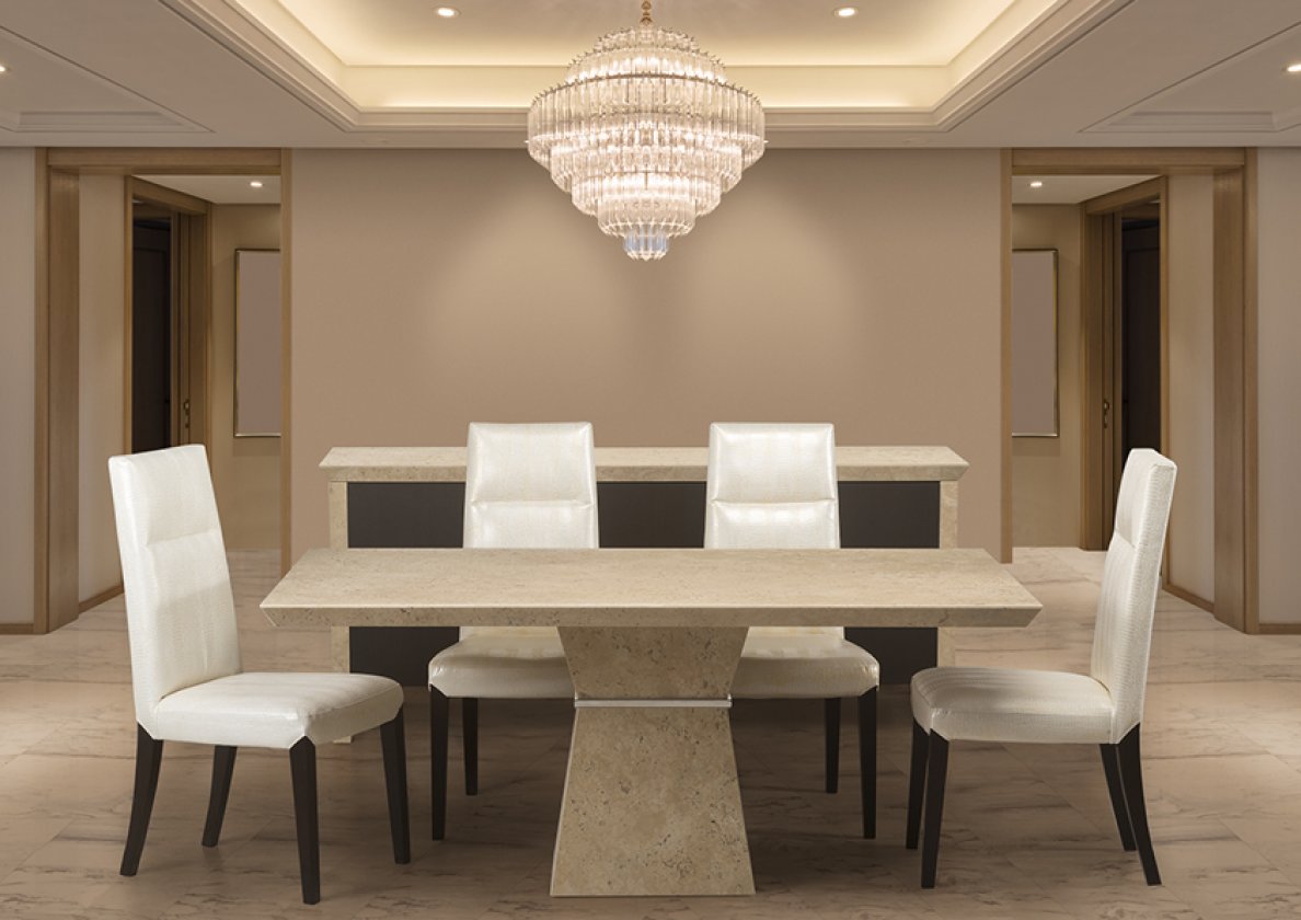 The Clepsy Plus dining room, with a beige table and white chairs, features a chandelier.