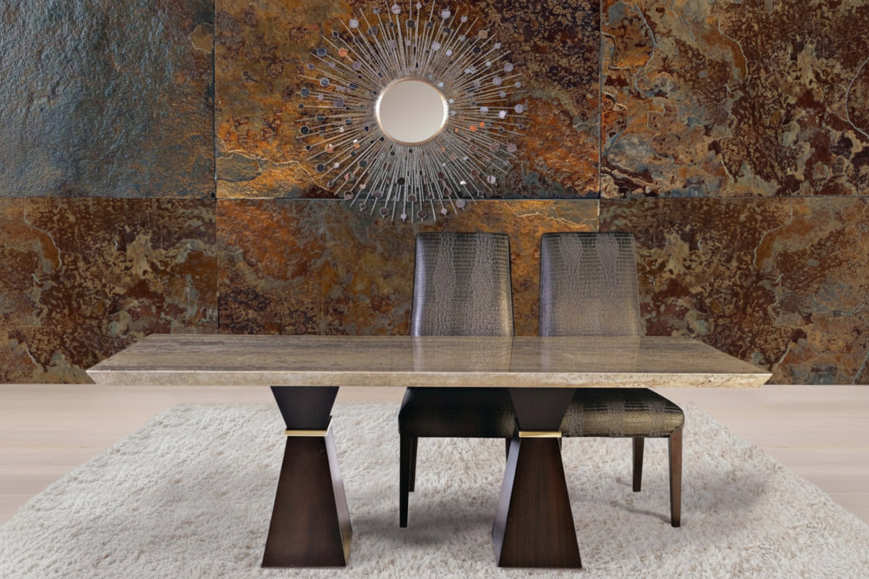 Clepsy Plus dining table with chairs against a textured wall with a decorative mirror.