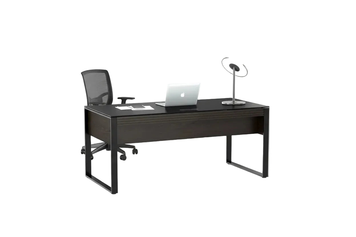 Black office desk with a chair, laptop, and lamp on a white background