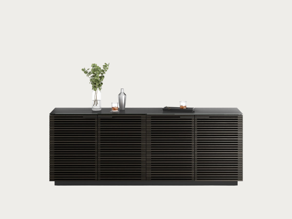 Black sideboard with decorative items on a white background
