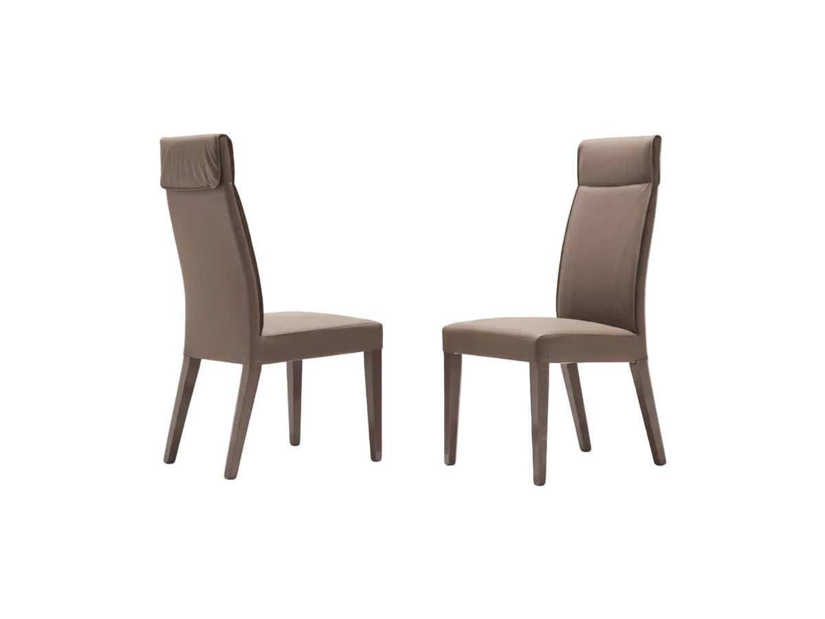 Corso Como: two brown chairs on a white background