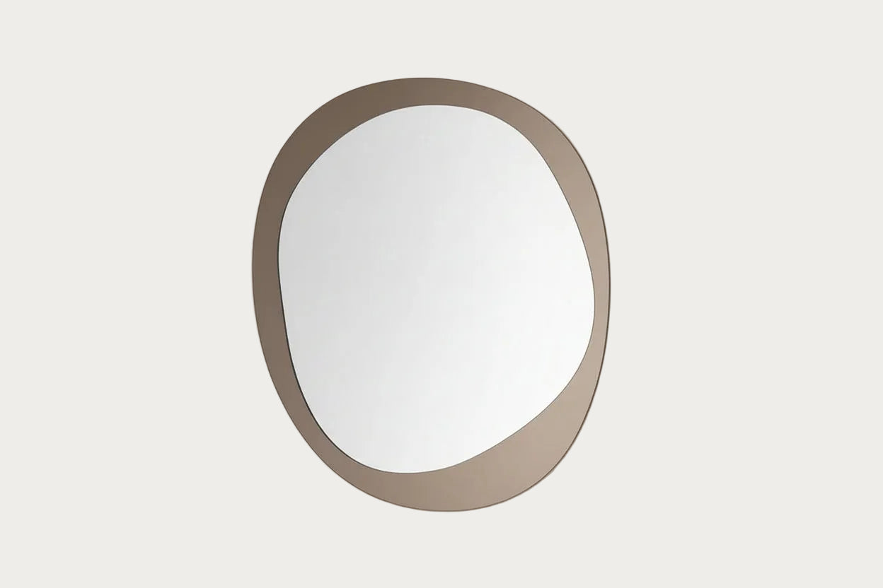 Corso Como round-shaped mirror with a gold frame on a white background.