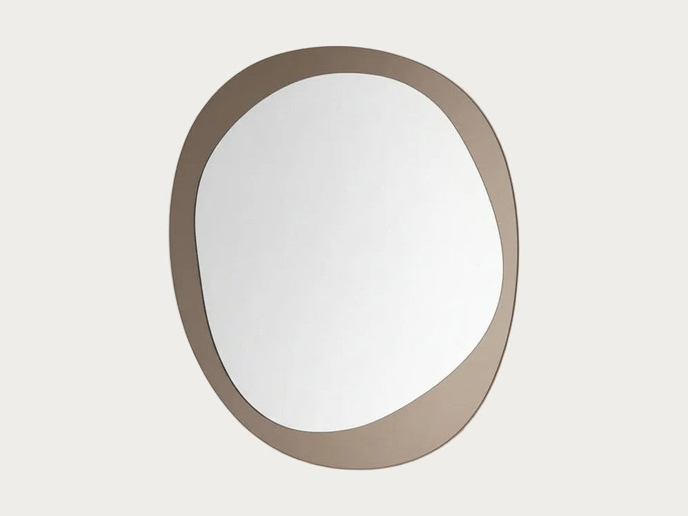 Corso Como round-shaped mirror with a gold frame on a white background.