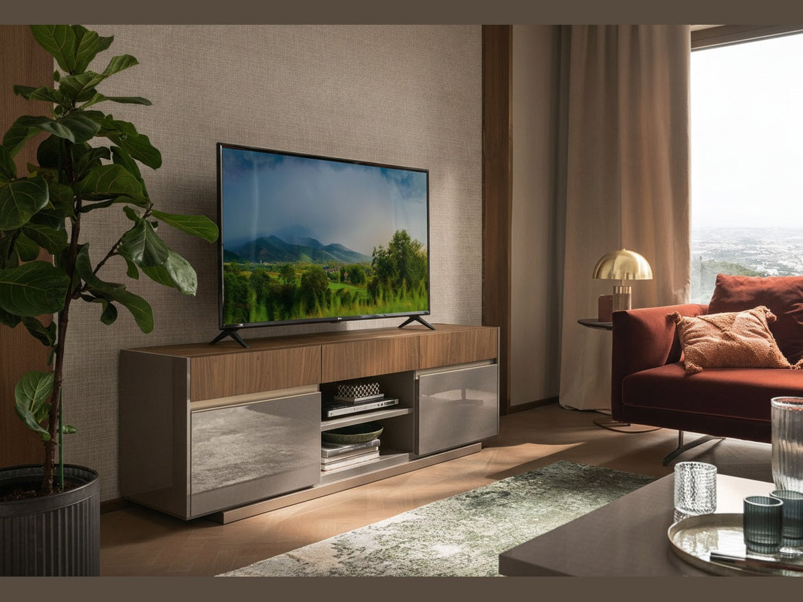 Corso Como TV Stand in a modern living room with a television on a wooden stand, a sofa, and decor items.