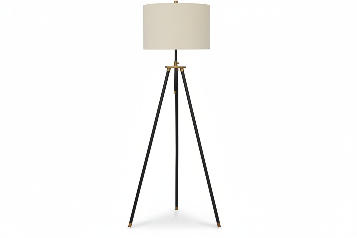 Cashner tripod floor lamp with a beige shade on a white background.