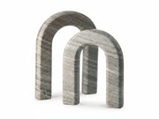 Two gray marble arches on a white background