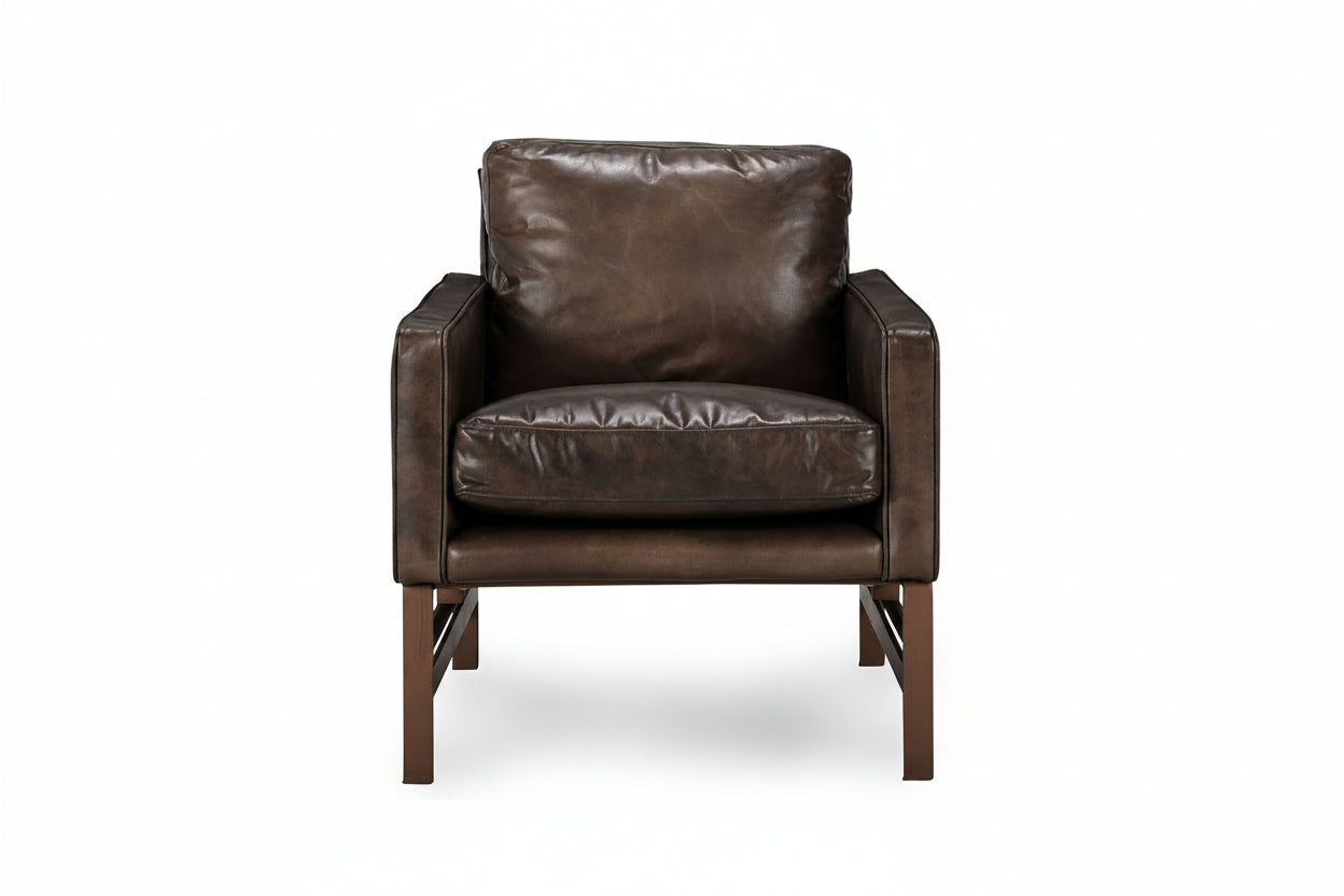 Brown leather armchair on a white background