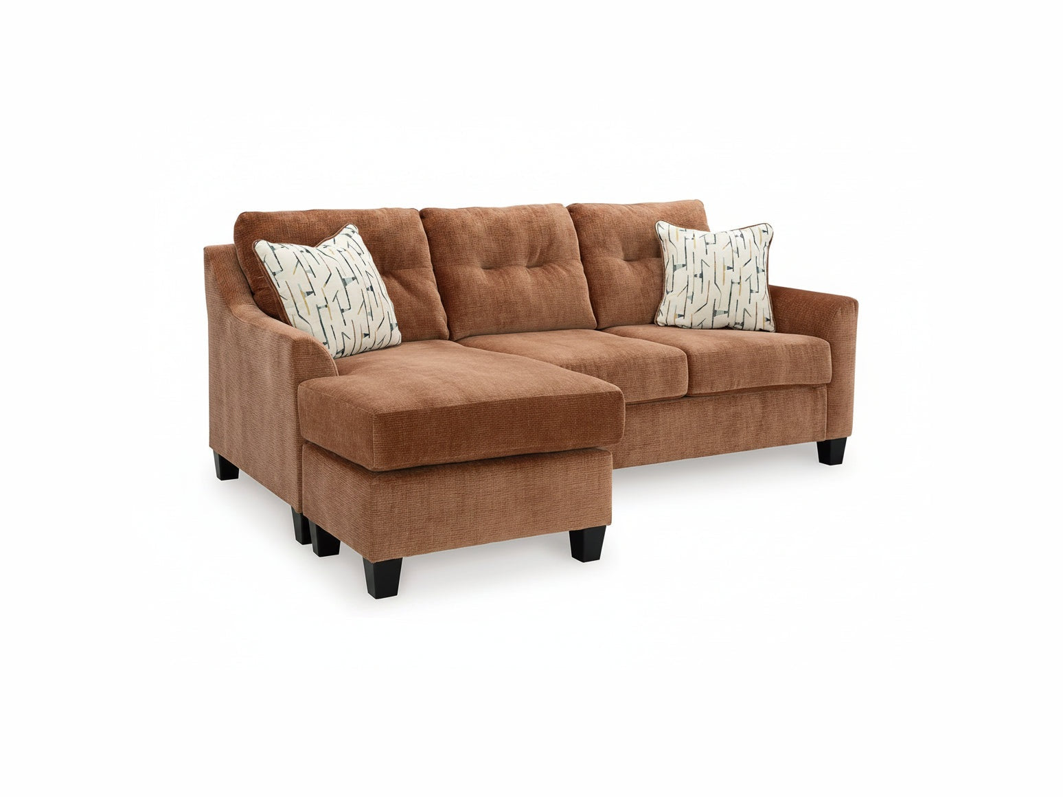 Brown sectional sofa with patterned cushions on a white background