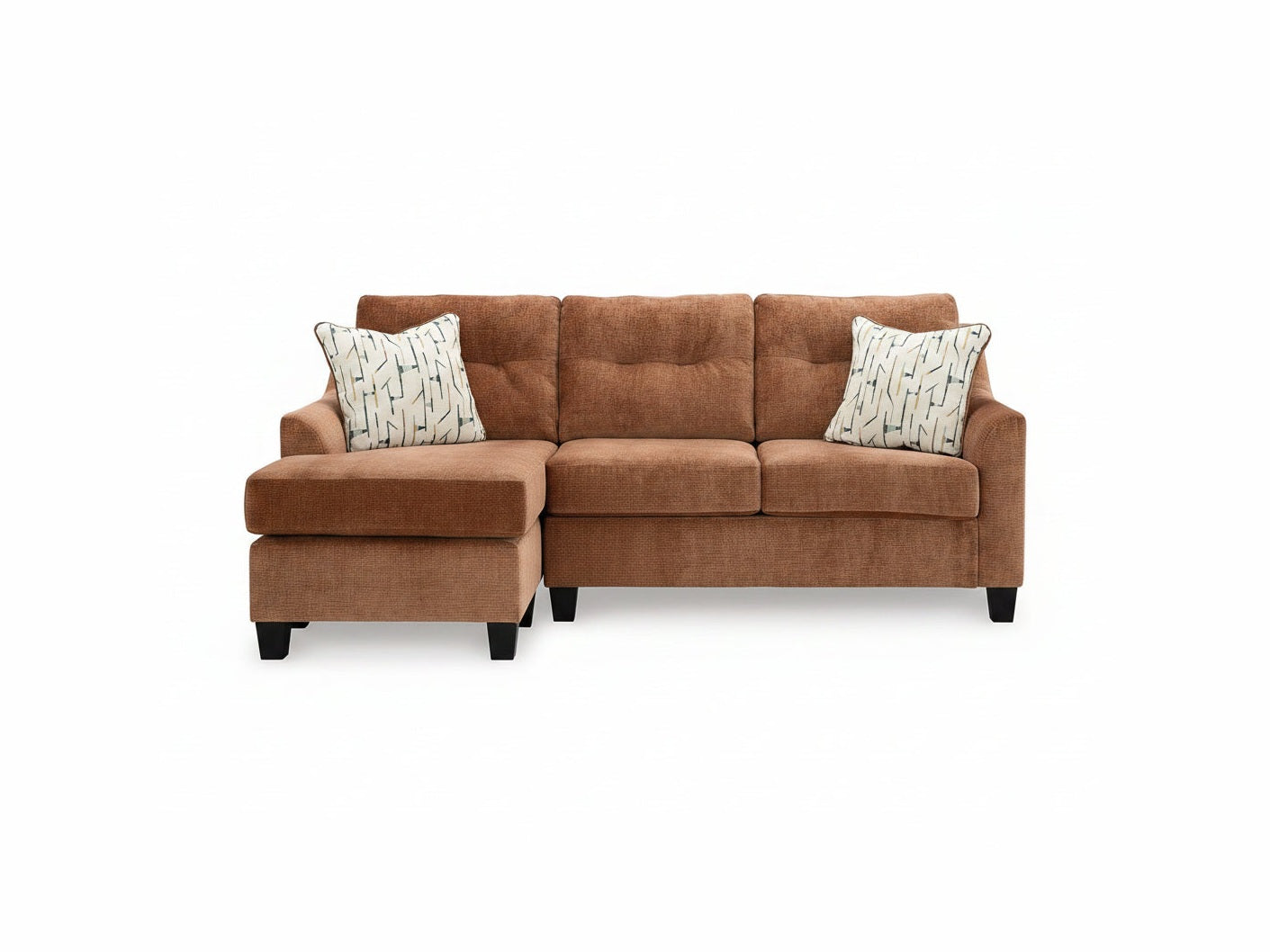 Brown sectional sofa with patterned cushions on a white background
