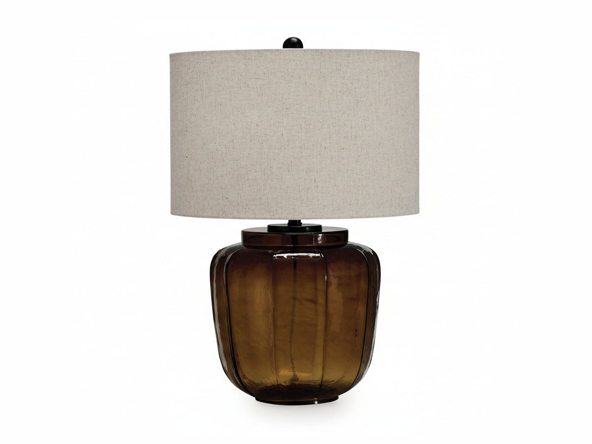 Bainmore table lamp with a brown glass base and beige lampshade on a white background