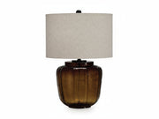 Bainmore table lamp with a brown glass base and beige lampshade on a white background