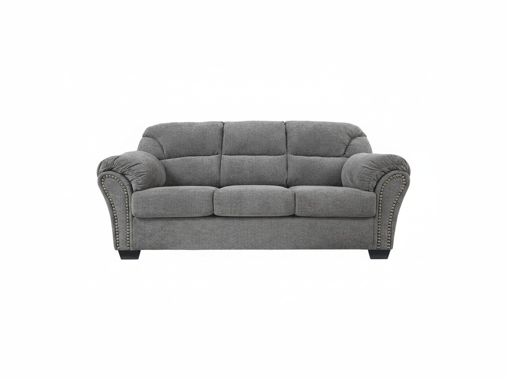 Gray sofa with nailhead trim on a white background