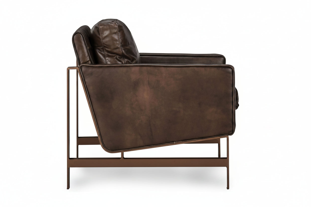 Brown leather armchair on a white background