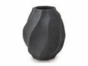 Black textured vase on a white background