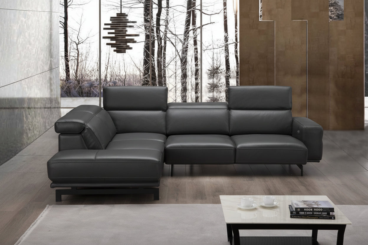 Davenport modern black leather sectional sofa in a living room setting with a coffee table and decor.