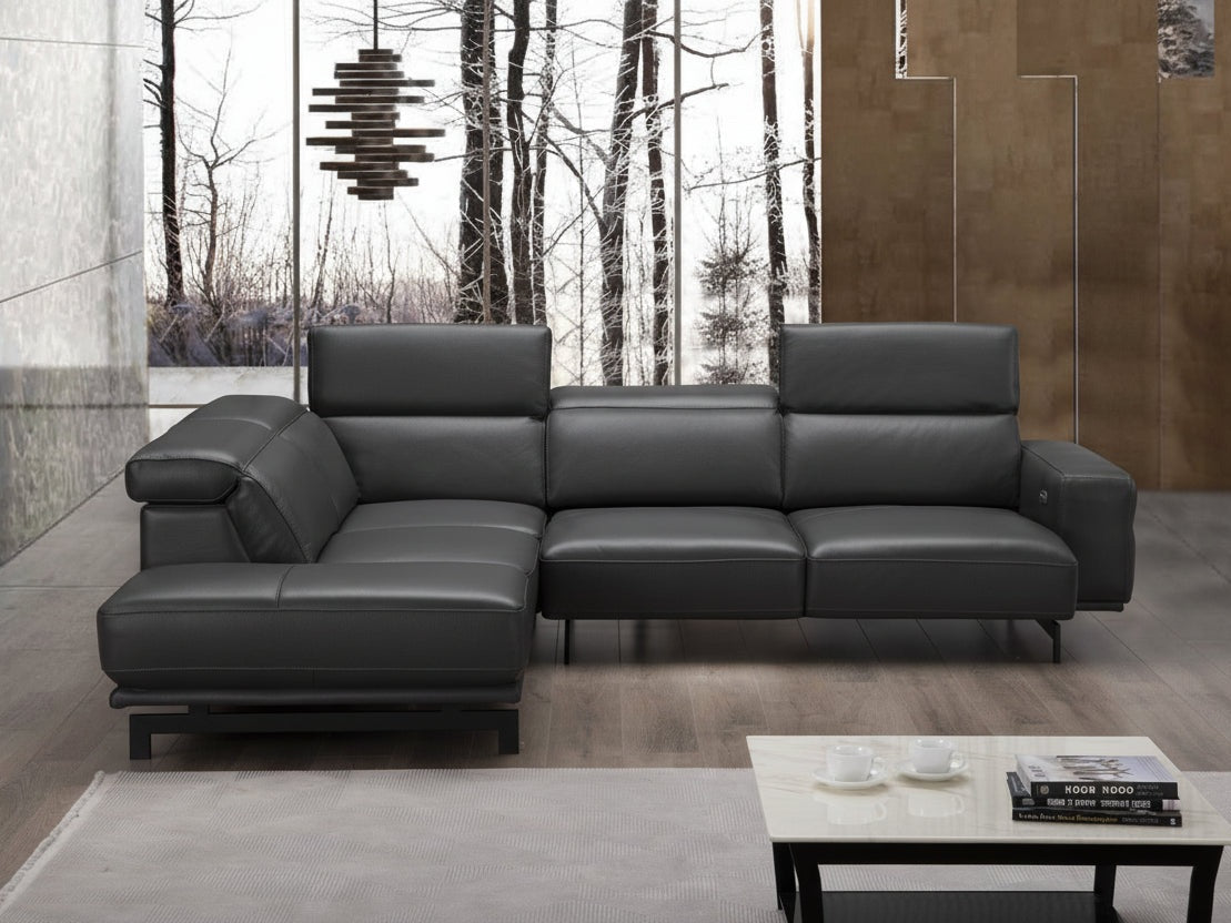 Davenport modern black leather sectional sofa in a living room setting with a coffee table and decor.