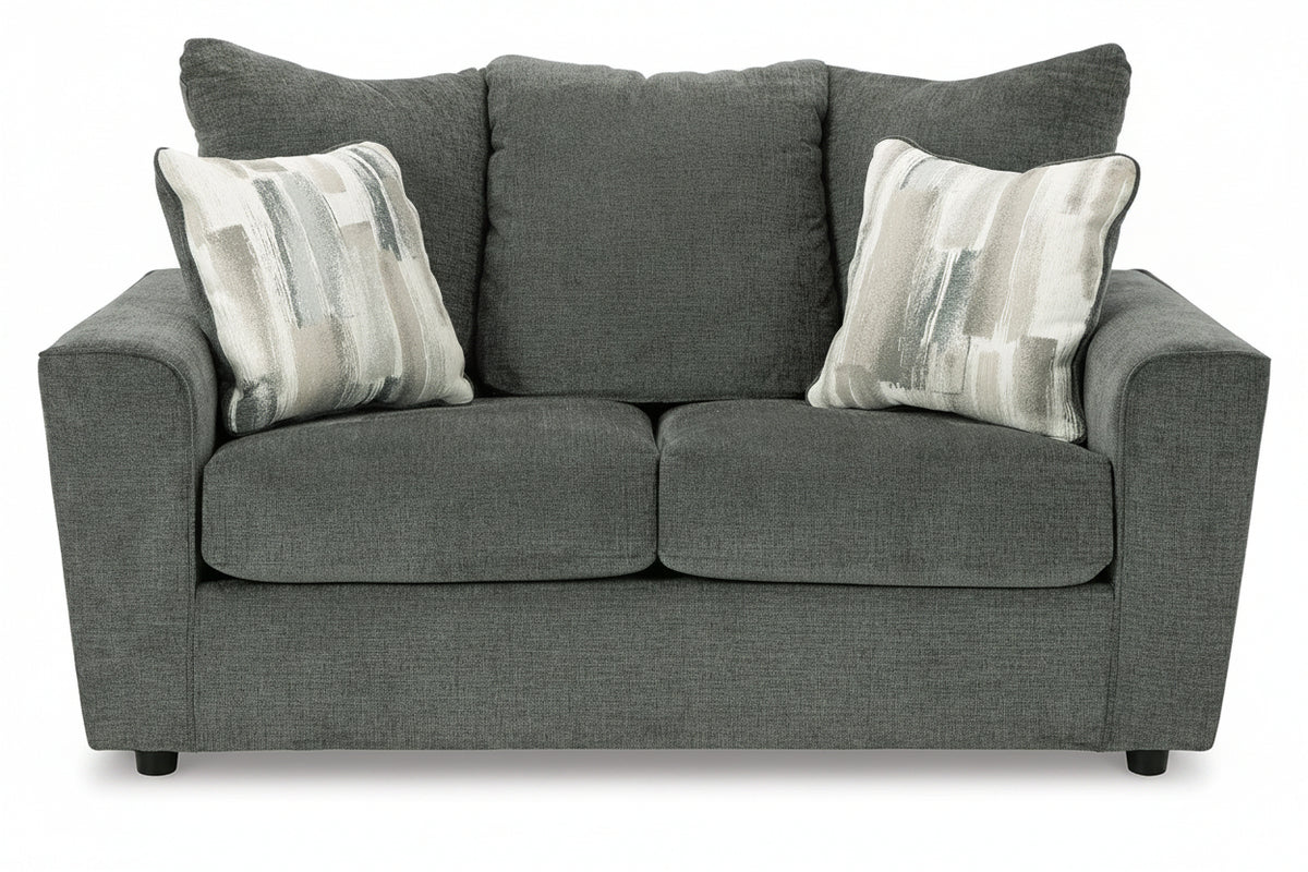 Gray sofa with patterned cushions on a white background