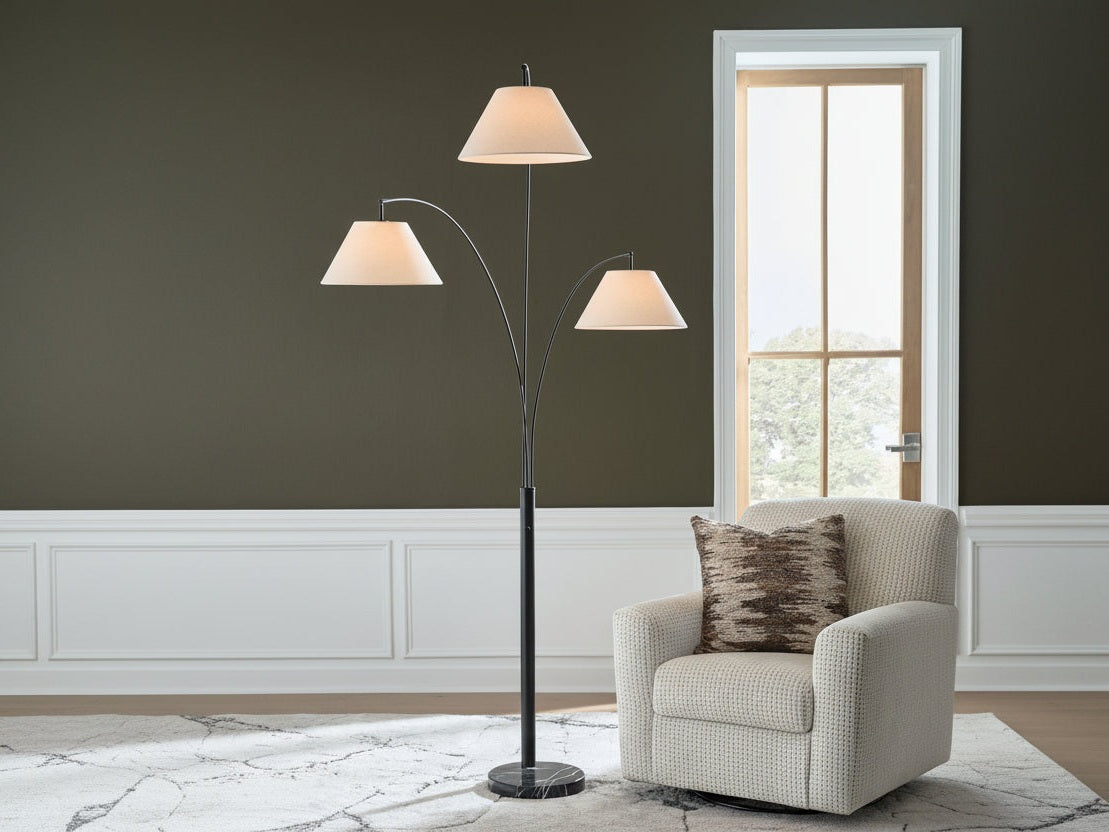 Gibbswellner three-light floor lamp in a living room setting with a neutral color scheme.