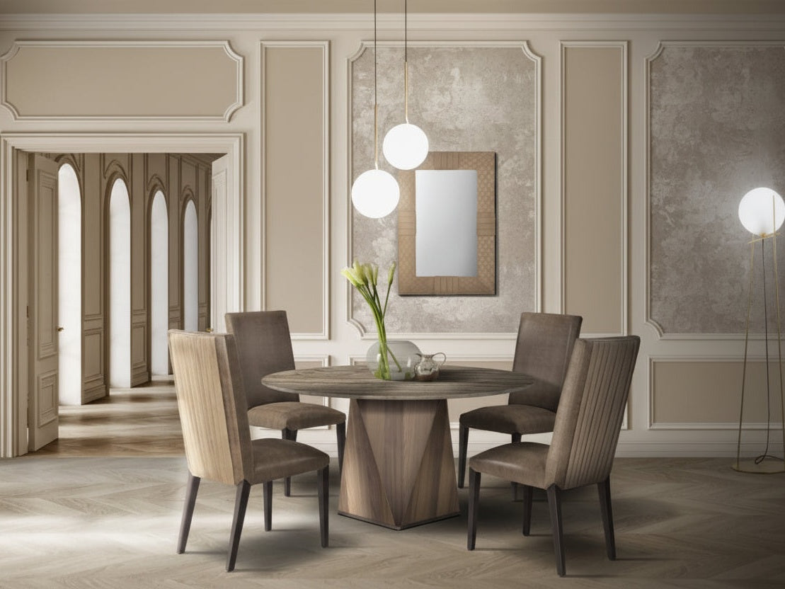 The Diamond dining room set with a round wooden table and four chairs in a stylishly decorated room.