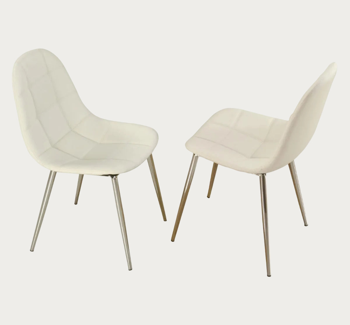 Two Donna white chairs with metal legs on a white background