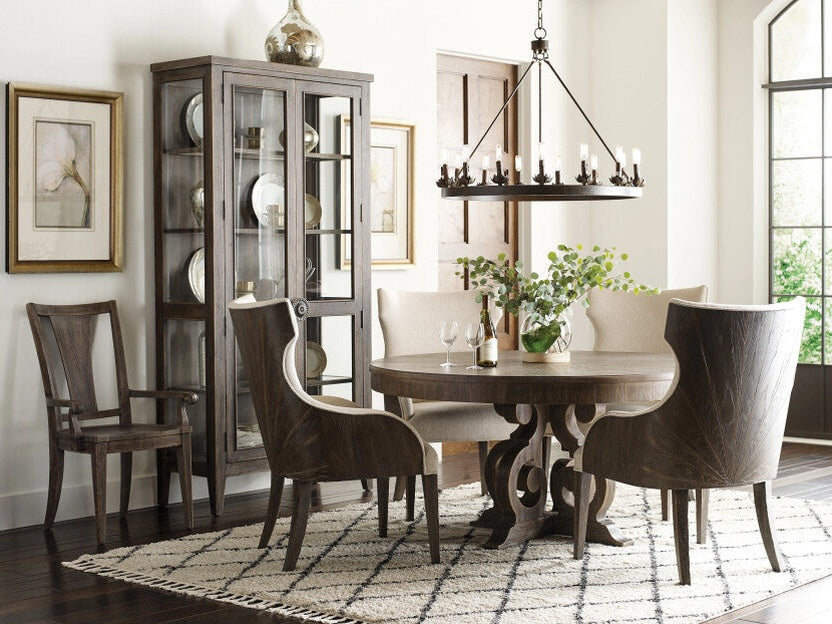 American Drew dining room set with a wooden table, chairs, and a chandelier.