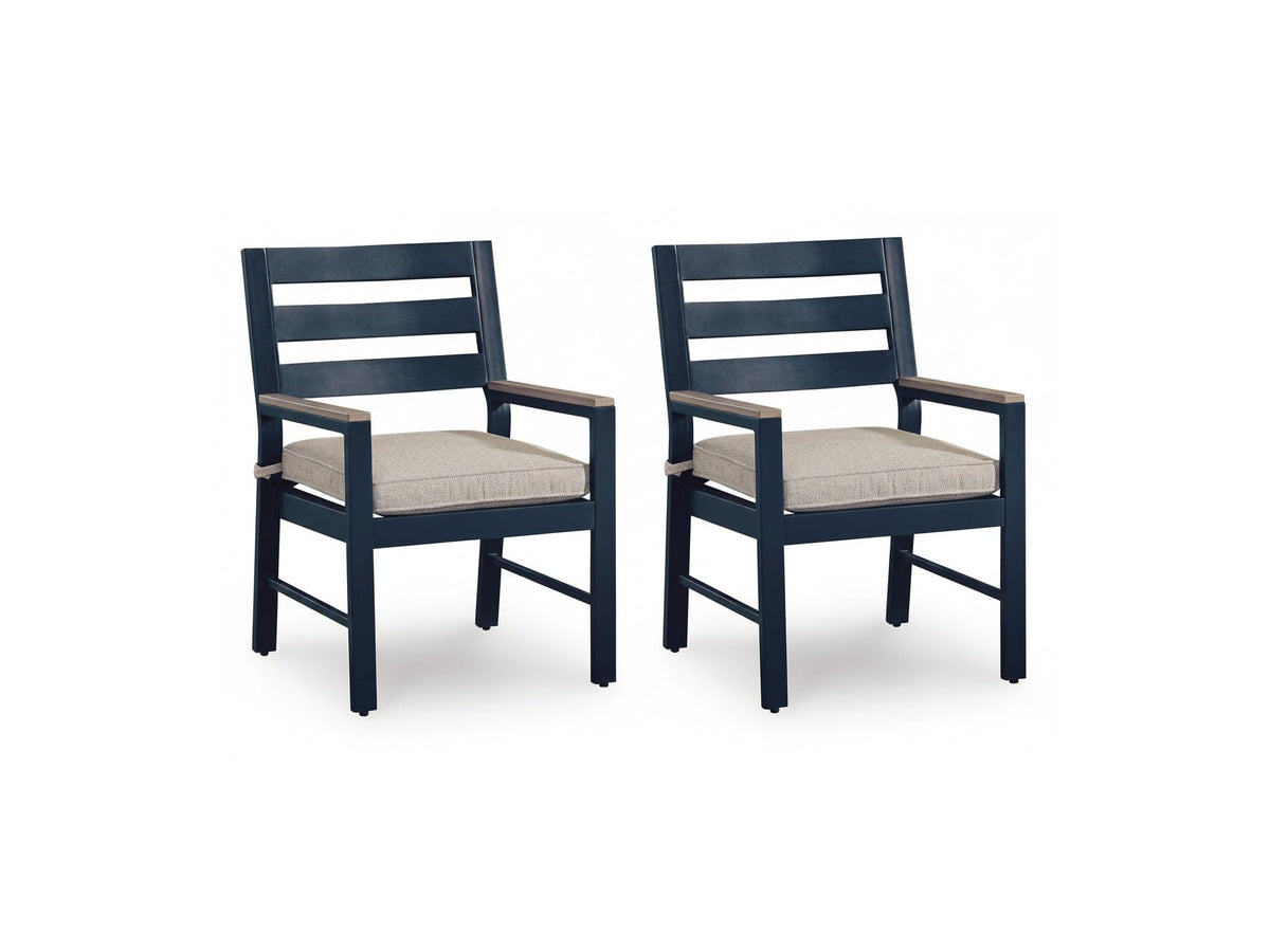 Two navy blue chairs with beige cushions on a white background