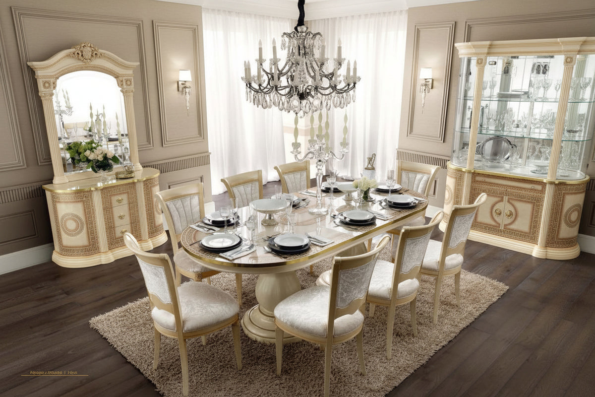 Elegant dining room with a round table and chairs in a luxurious setting.