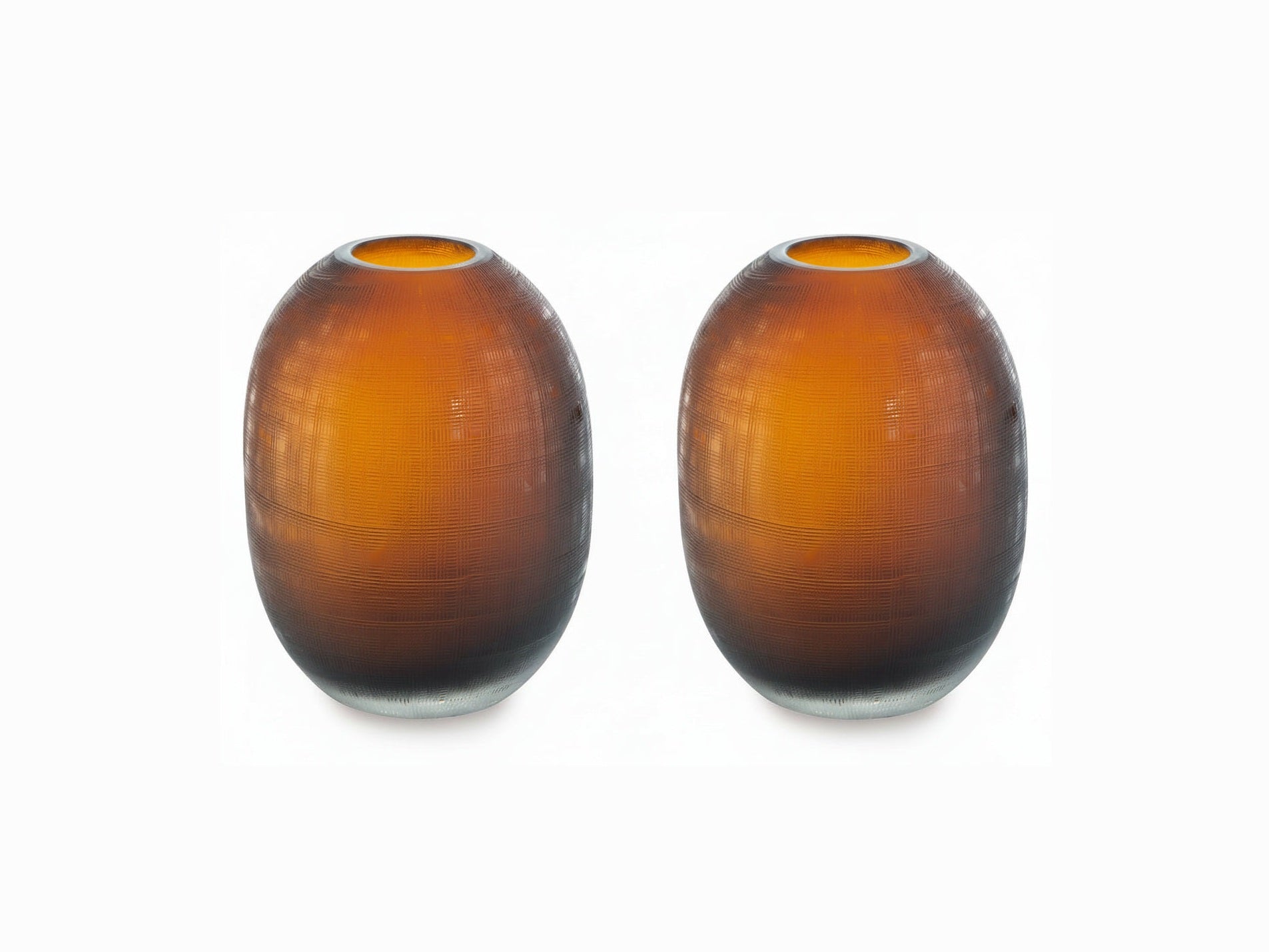 Two amber-colored glass vases with textured surface on a white background