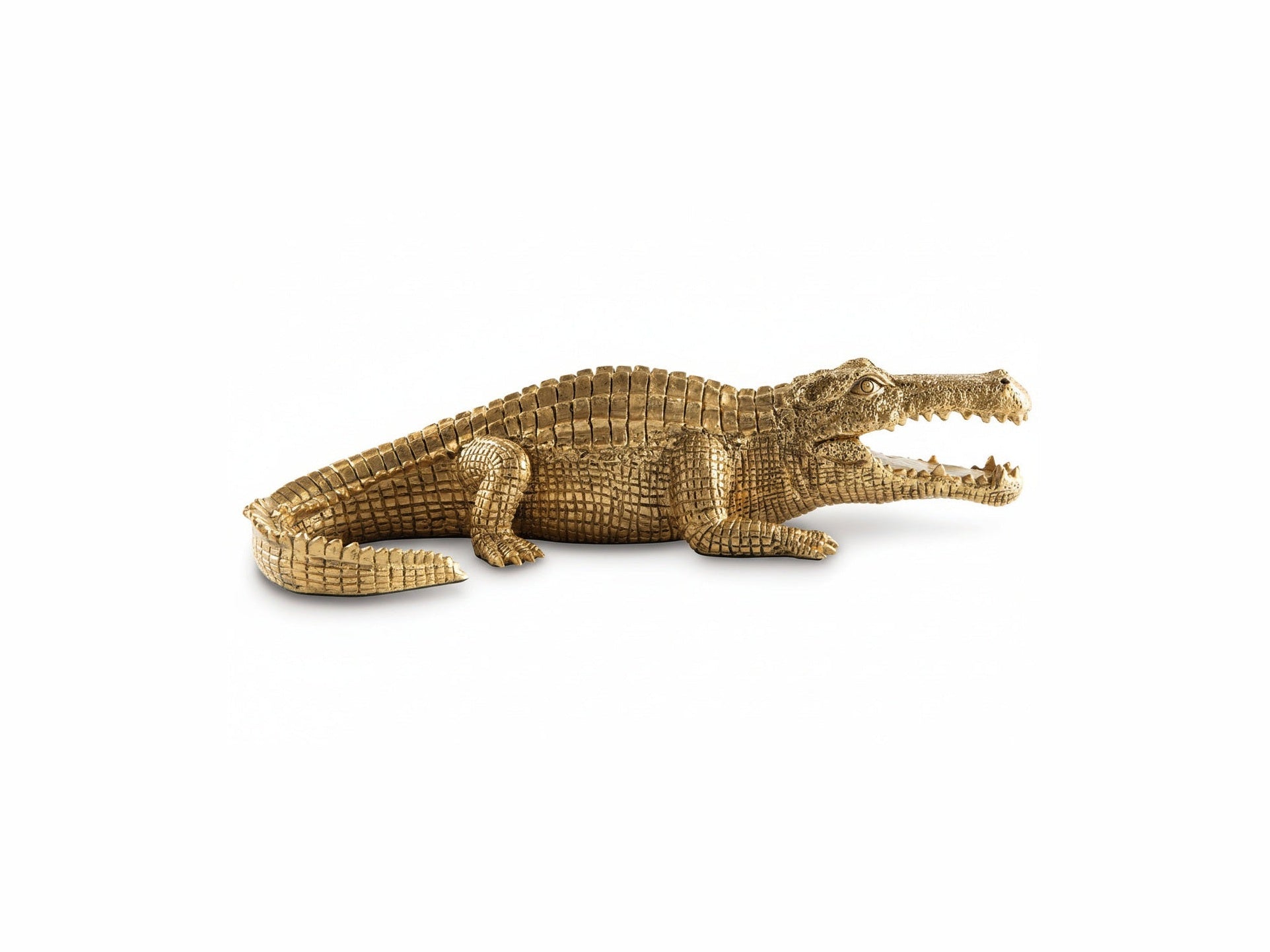 The Lauretman gold alligator figurine on a white background.