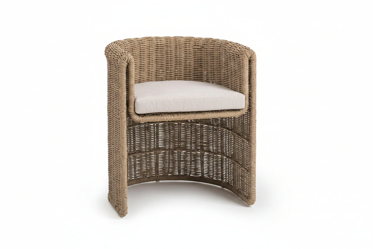 Wicker chair with a cushion on a white background