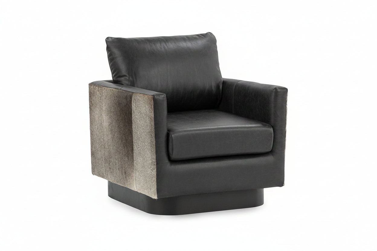 Black leather armchair with textured armrests on a white background
