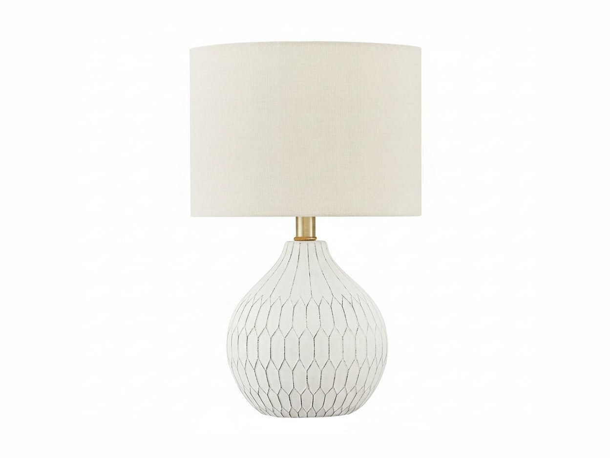 Wardmont table lamp with a textured white base and beige fabric shade on a white background