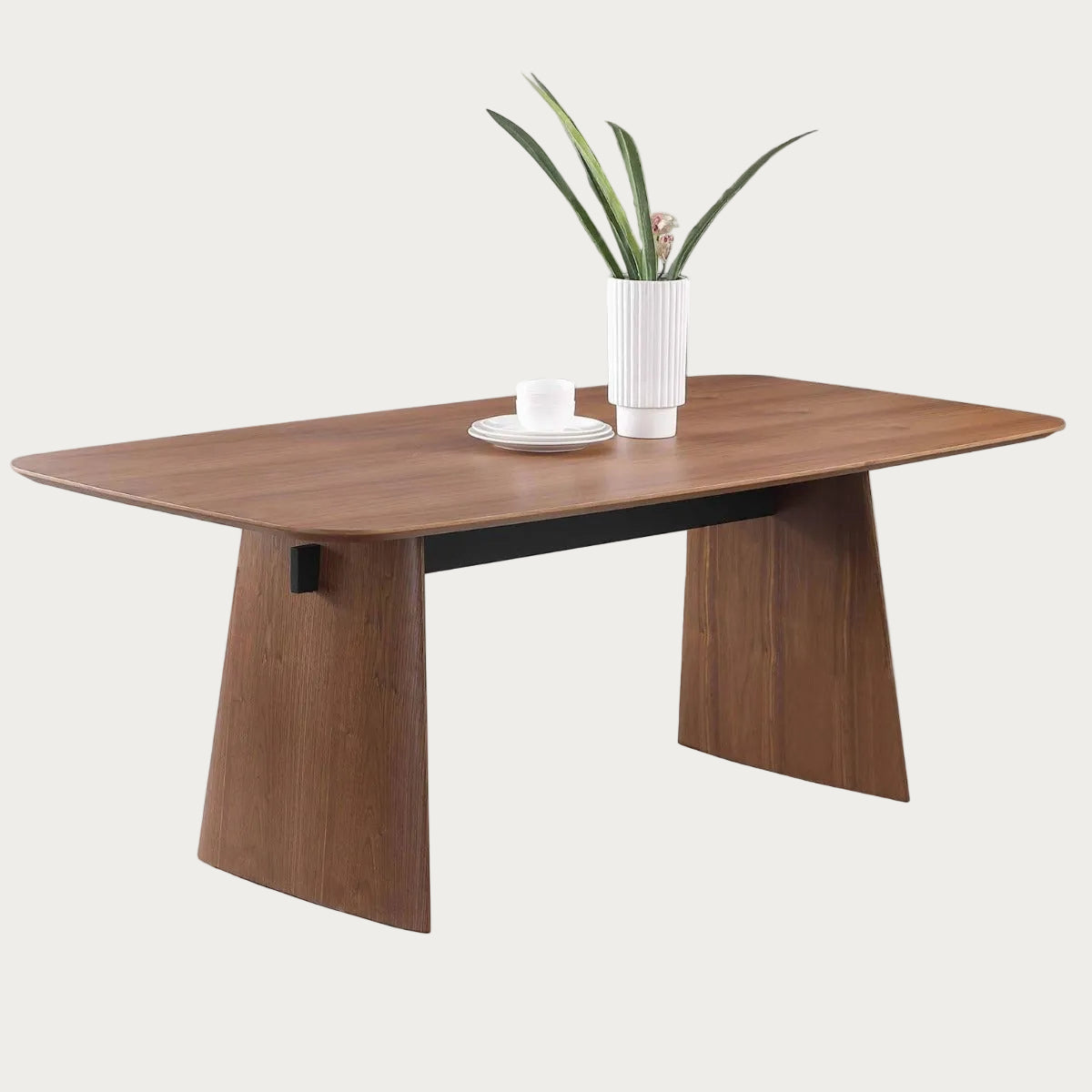 Eden wooden dining table with a plant and plates