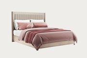 The Ellen modern bed with red and white bedding on a white background