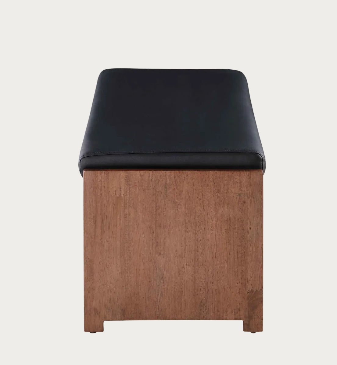 Wooden stool with black cushioned seat on a white background