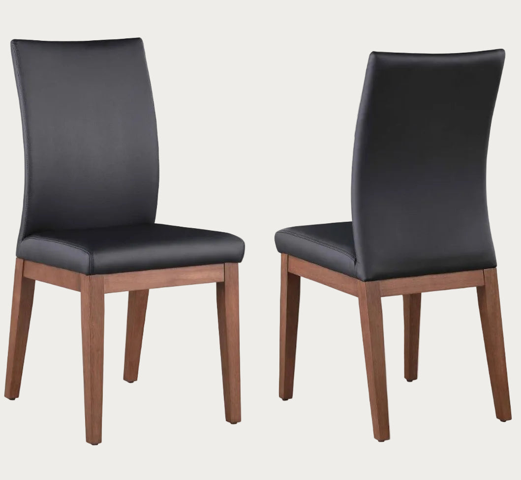 The Emma Two black chairs with wooden legs